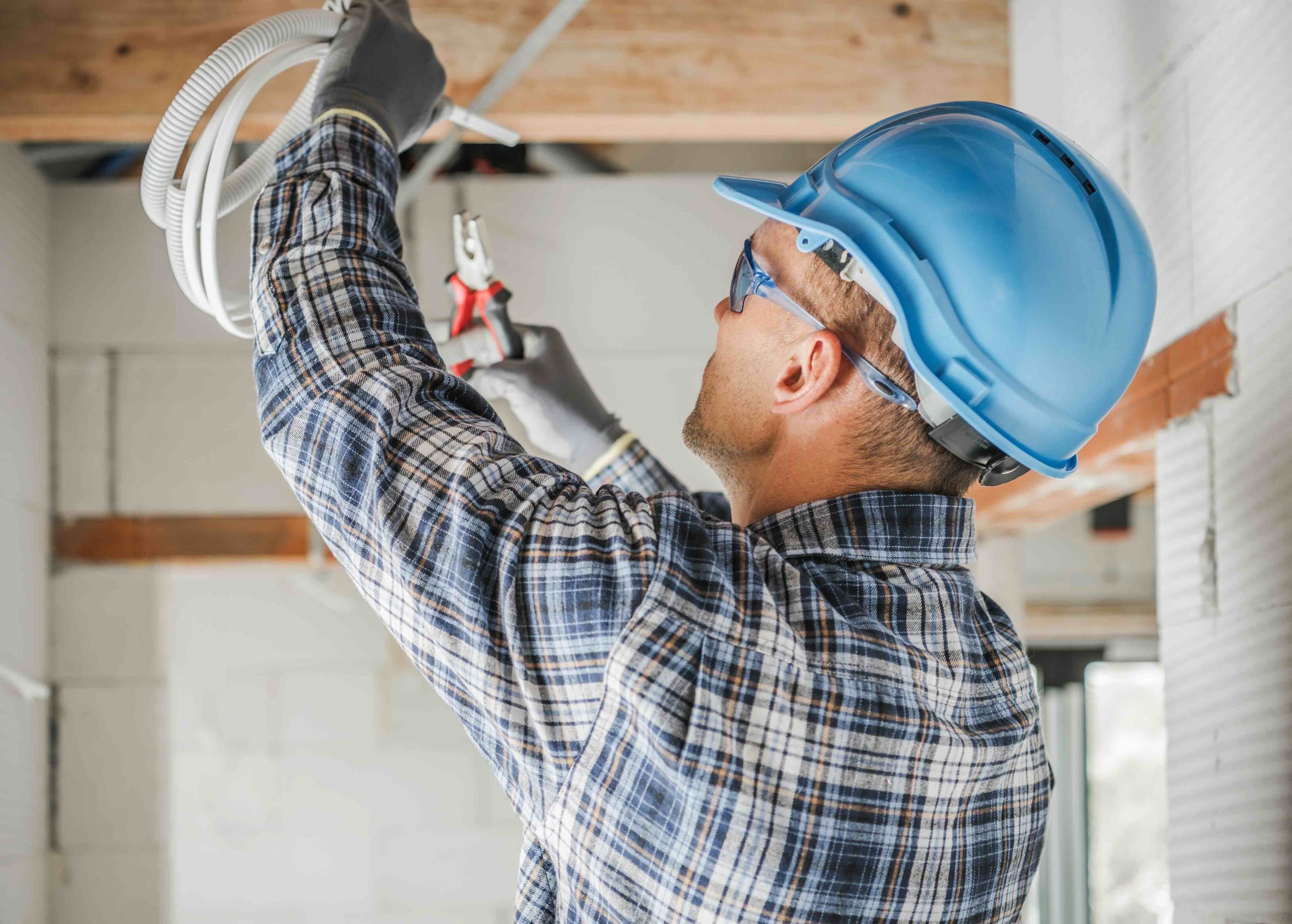 A photo of an electrician providing wiring and lighting installation services.