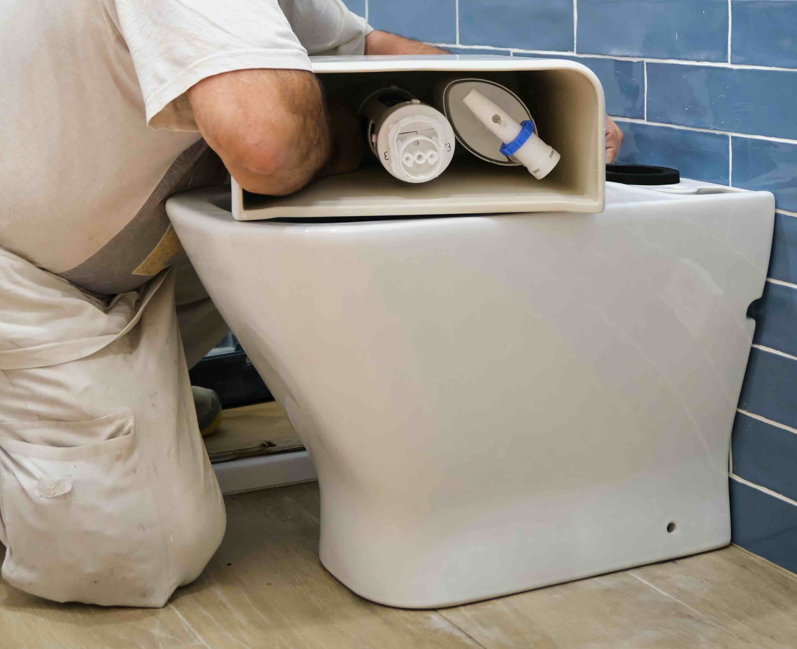 Toilet repair 2 A plumber installing a toilet.