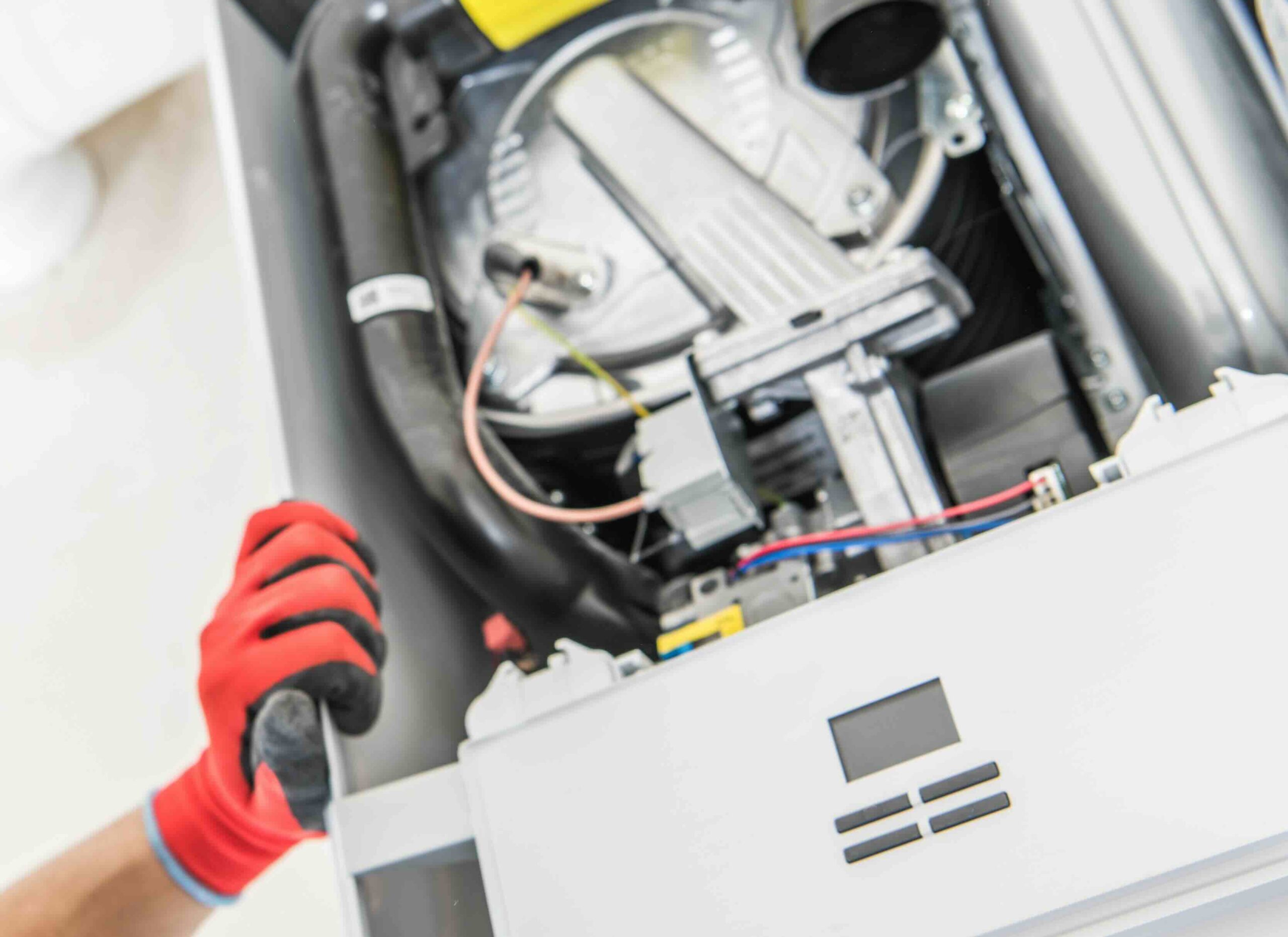 A photo of heating services technician at work.